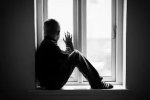 lonely-boy-sitting-on-windowsill-260nw-369854843-1.jpg